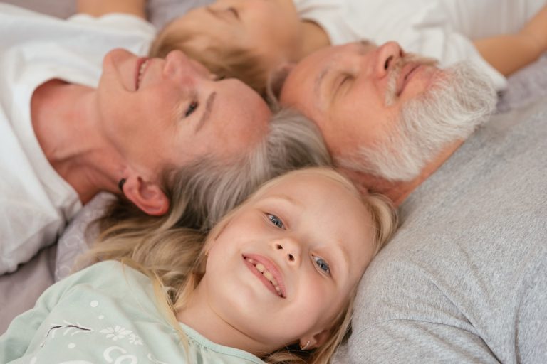 Family laying on the floor.